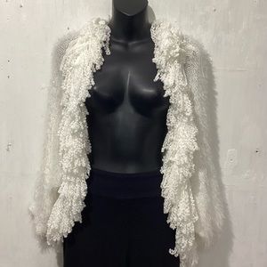 Women’s Sioni white fringed knit shrug. Short sleeves, hi-lo hem. Size S/M. NWT